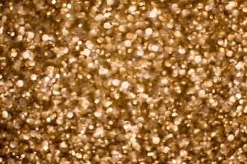 Shiny golden lights with glitter bokeh texture effect Christmas decoration abstract background