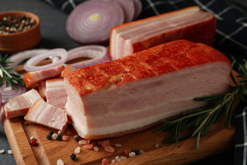 Concept of tasty snack with bacon on wooden board, close up