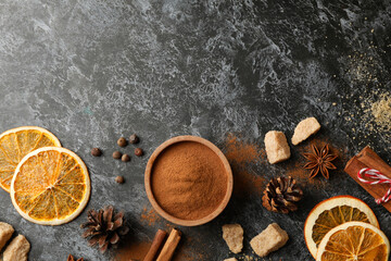 Ingredients for cooking mulled wine on black smokey background