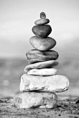 Zen stones on the beach - black and white image