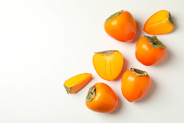 Fresh ripe persimmon on white background, space for text