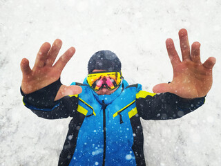 Portrait of snowboarder. Snow background.  