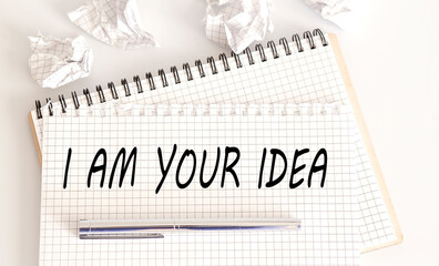 Text on notepad I AM YOUR IDEA on white background. Business Concept