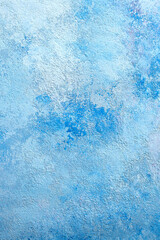Photography of hand-painted background texture in blue and white strokes, empty place for text