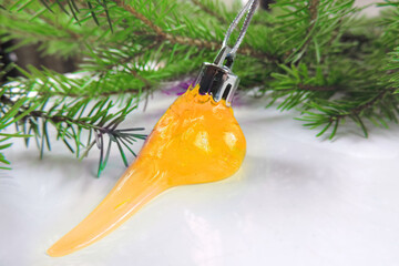 new year christmas ball made of neon yellow slime, spreading slime against  background of christmas...