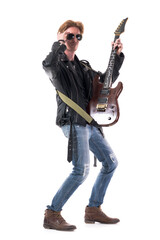 Fototapeta na wymiar Cool macho stylish redhead rocker posing with his electric guitar. Side view. Full body length isolated on white background. 
