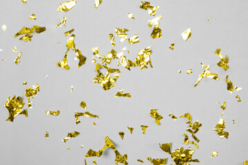 Abstract festive party backdrop with yellow shiny confetti.