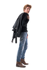 Fototapeta premium Side view of stylish walking redhead man carrying leather jacket over the shoulder. Full body length isolated on white background. 