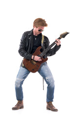 Talented young stylish male rocker guitarist playing electric guitar solo with passion. Full body...