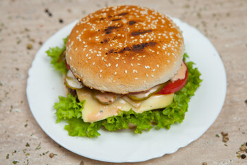 Fresh and juicy hamburger. Delicious cheese burger on a rustic wooden table