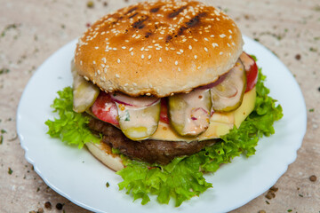 Fresh and juicy hamburger. Delicious cheese burger on a rustic wooden table