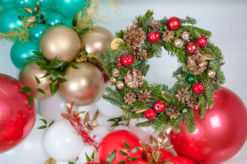 Fototapeta na wymiar Christmas wreath, on a background of colorful balls. Holiday concept, New Year, Christmas. greeting card