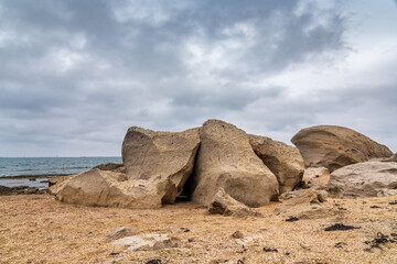 Fototapeta na wymiar Huge boulders on sea beach