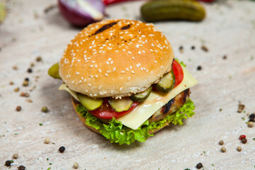 Fresh and juicy hamburger. Delicious cheese burger on a rustic wooden table