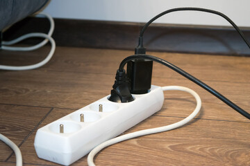 View of the white extension cord with chargers turned on