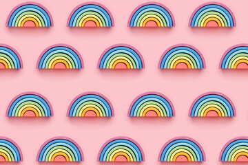 Colorful Waldorf wooden rainbow in a montessori teaching pedagogy on pink background pattern