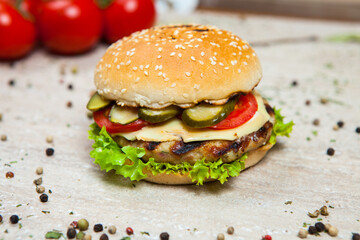 Fresh and juicy hamburger. Delicious cheese burger on a rustic wooden table