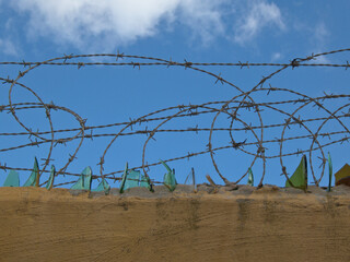 Barbed wire and broken glass barrier