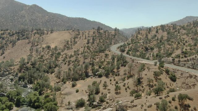 Highway and Kern River In Sequoia National Forest California Aerial Shot Forward