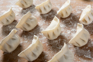 Dumplings background. Cooking dumplings in the kitchen.