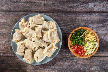 Close up fresh boiled dumplings. Chinese food on rustic old vintage wooden background