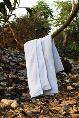 Colorful cotton bath towel hanging in the open area. Cotton bath towel isolated.