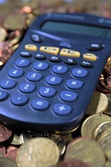 calculator and coins