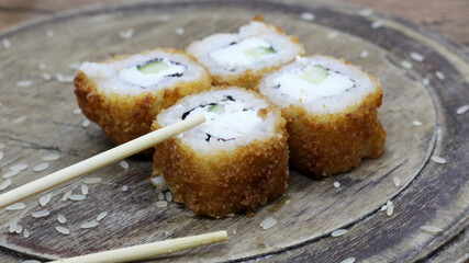 Hot vegetable Japanese rolls, Asian food, wooden board