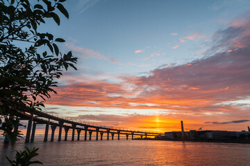 Fototapeta na wymiar Sunset landscape with highway bridge