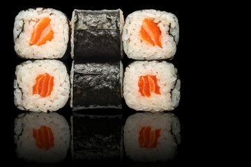 Seafood rolls - isolated black background.