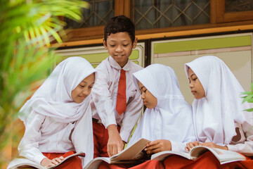 a portrait of a muslim school student having discussion in school garden