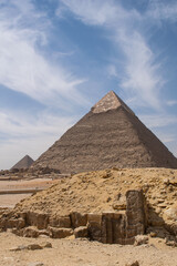 Fototapeta na wymiar Vertical image of the great pyramids of Egyot with soft clouds above