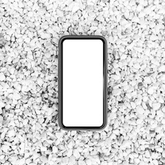 Smartphone with mockup on small stones. Black and white photo.
