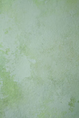 Vertical photography of hand-painted background texture in light green