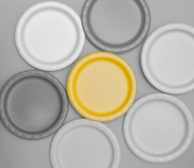 Set of plates in trendy ultimate gray and illuminating color. Color of the Year 2021.