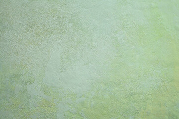 Horizontal photography of hand-painted background texture in light green, empty place for text