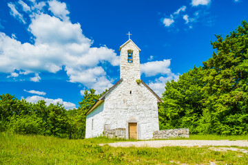 St Francis church near Gacka river in Lika reagion in Croatia, countryside landscape