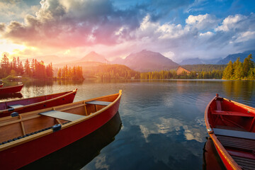 Mountain lake and empty boats in National Park High Tatra.