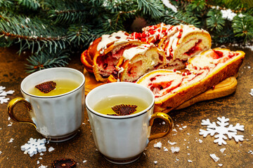 Christmas strawberry pie with white chocolate icing and topping, hot fragrant tea