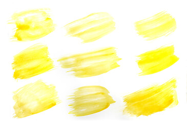 Bright yellow brush stroke painted in watercolor on clean white background
