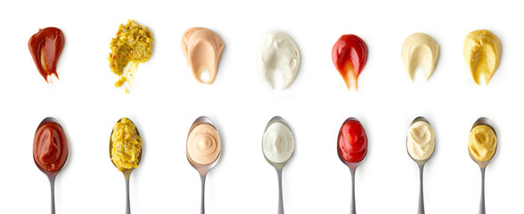 Set of different sauces in spoons top view isolated on white background