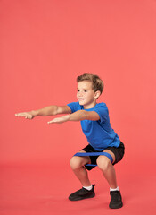 Adorable boy doing exercise with elastic fitness band