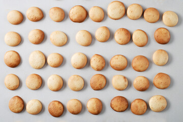 A pattern of small pancakes. Background from orange toasted round biscuits. home bakery