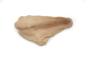 Fresh frozen sea fish on a white background. A piece of cod fillet. Isolate. View from above. Copyspace