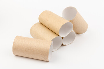 empty paper toilet rolls on white background