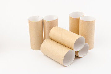 empty paper toilet rolls on white background