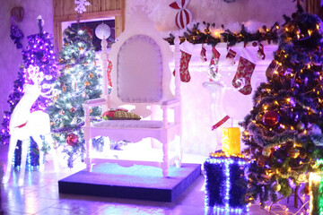 Christmas tree and chair for Santa Claus in a cozy living room