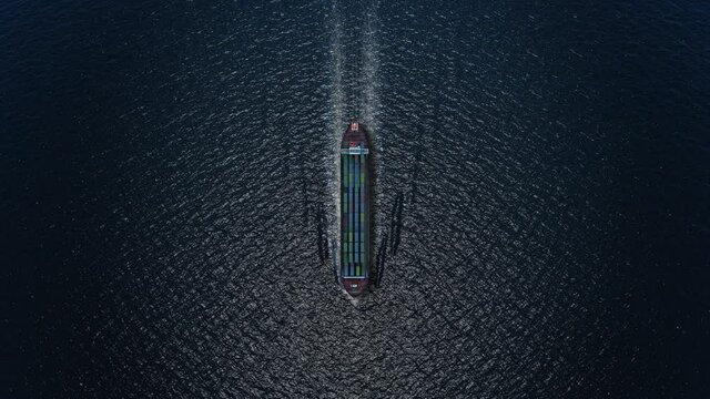 Cargo ship with containers Sailing at night with The moon light- Aerial
, Freight Shipping export and import concept, container ship carries cargo across the ocean. Transportation. Delivery. Logistics