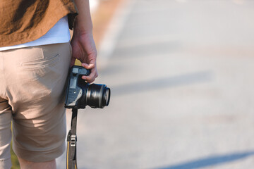 Photographer with digital camera.