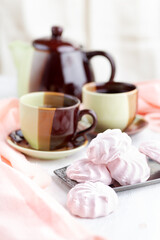 Russian Strawberries with cream marshmallows and tea on a bright table. still life, selective focus.